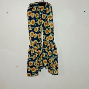 Boutique sunflower pants with flowing legs .Silky type material .